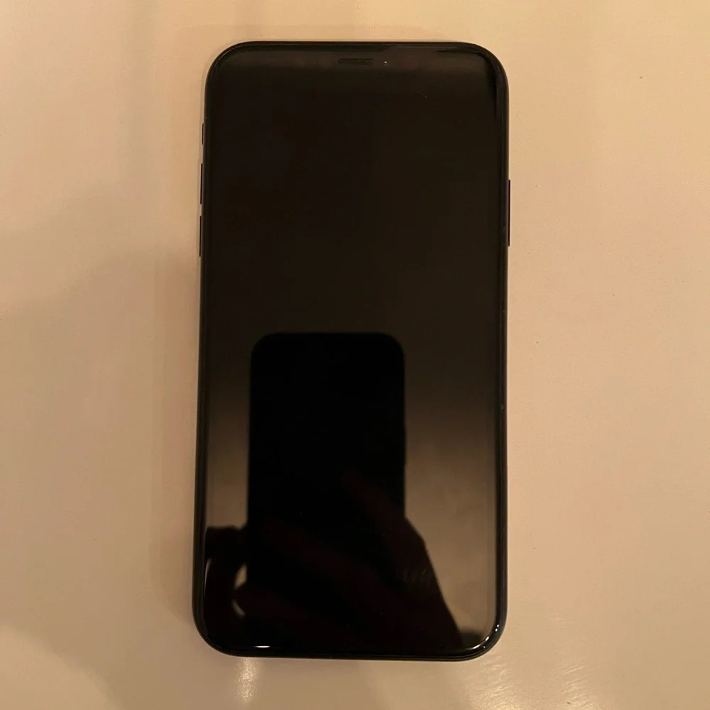 Apple Black XR - 128 GB, unlocked phone with two cases.